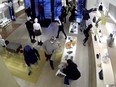Surveillance footage shows suspects are seen raiding a Louis Vuitton store in Los Angeles.