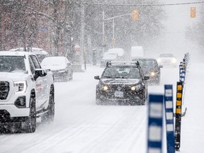 Files: Traffic was slow on O'Connor Street as Ottawa was blanketed with snow, Saturday, Dec. 4, 2021. 



ASHLEY FRASER, POSTMEDIA