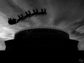 Santa Claus flies over the Canadian Tire Centre. 'Twas the Night Before Christmas.