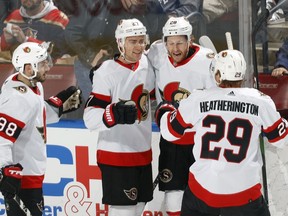 Dylan Gambrell of the Ottawa Senators is congratulated by teammates after he scored a second-period goal against the Florida Panthers at the FLA Live Arena on Tuesday, Dec. 14, 2021 in Sunrise, Fla.