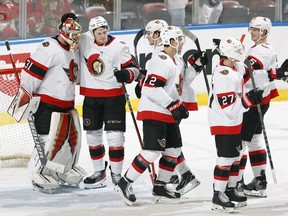 Goaltender Anton Forsberg of the Ottawa Senators is congratulated by teammates after their 8-2 win against the Florida Panthers at the FLA Live Arena on December 14, 2021 in Sunrise, Florida.