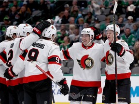 Drake Batherson, Brady Tkachuk and Josh Norris celebrate with other teammates after a Norris goal. The line has been on fire in the past six games with a combined 31 points.