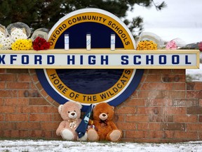 Files: Stuffed bears and flowers are gathered at a makeshift memorial outside of Oxford High School on December 01, 2021 in Oxford, Michigan.
