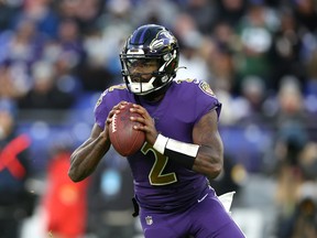 Quarterback Tyler Huntley of the Baltimore Ravens drops back to pass against the Green Bay Packers on Dec. 19, 2021 in Baltimore, Maryland.
