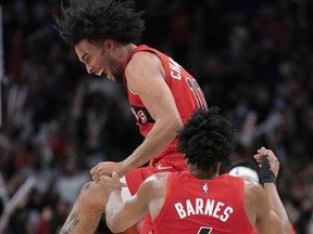 Toronto Raptors forward Justin Champagnie celebrates at the end of the fourth quarter against the Oklahoma City Thunder.