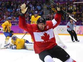 Canada's Sidney Crosby celebrates after scoring at the 2014 Olympics.