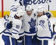 Auston Matthews celebrates his first-period goal with John Tavares and William Nylander against the Edmonton Oilers at Rogers Place on Tuesday night.