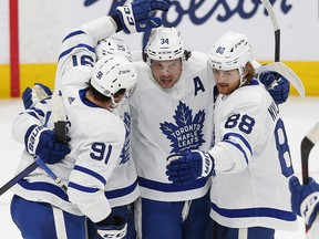 Auston Matthews celebrates his first-period goal with John Tavares and William Nylander against the Edmonton Oilers at Rogers Place on Tuesday night.