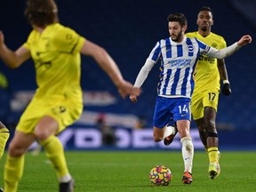 Brighton midfielder Adam Lallana runs with the ball during the English Premier League match between Brighton and Hove Albion and Brentford at the American Express Community Stadium in Brighton, England, Sunday, Dec. 26, 2021.