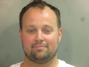 In this handout photo provided by the Washington County Sheriff’s Office, former television personality on "19 Kids And Counting" Josh Duggar poses for a booking photo after his arrest April 29, 2021 in Fayetteville, Ark.