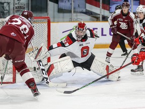 Ottawa 67's goalie Will Cranley makes a save against Peterborough's Jax Dubois.  Ottawa won 4-3.