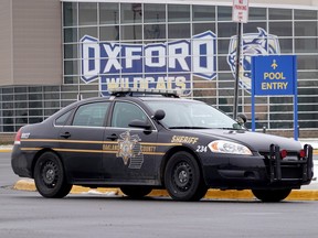 A police vehicle remains parked outside of Oxford High School on December 01, 2021 in Oxford, Michigan.