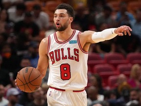 Chicago Bulls guard Zach LaVine dribbles the ball up the court against the Miami Heat during the first half at FTX Arena.