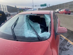 A driver in her 30s suffered series facial and head injuries Tuesday when a sheet of ice flew off another vehicle as she was traveling on Hwy 417.