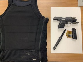 OPP stopped driver near Kingston found wearing a bulletproof vest and alleged carrying a small arsenal on board.