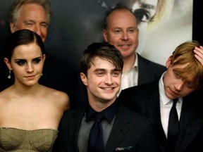 Cast members Rupert Grint (R), Daniel Radcliffe and Emma Watson (L) arrive for the premiere of the film "Harry Potter and the Deathly Hallows: Part 2" in New York July 11, 2011.