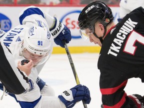 Senators captain Brady Tkachuk has his eyes on the puck as he faces off against the Lightning's Steven Stamkos in the second period of Saturday's game. Tkachuk also found time to produce his first NHL hat trick in Ottawa's 4-0 victory.