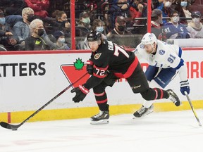 Senators defenceman Thomas Chabot (72) skates with the puck in front of Lightning centre Steven Stamkos (91) in the first period on Saturday afternoon.