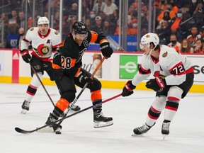 Philadelphia Flyers centre Claude Giroux (28) controls the puck against Ottawa Senators defenceman Thomas Chabot (72) in the first period at the Wells Fargo Center.
