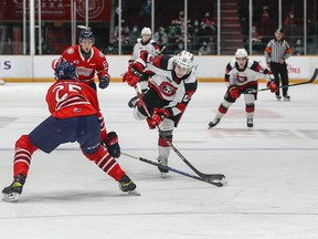 67's forward Will Gerrior takes a wrist shot past the Generals' David Jesus (25) in the third period of Friday's game, which Oshawa won 4-2.