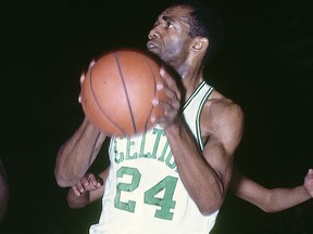 Sam Jones #24 of the Boston Celtics handles the ball against the Philadelphia 76ers circa 1962 at the Boston Garden in Boston, Massachusetts.