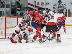 The Generals' Stuart Rolofs (89) is surrounded by 67's players attempting to help out netminder Will Cranley during a scramble in front of the crease during Friday night's game.