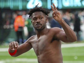 Tampa Bay Buccaneers wide receiver Antonio Brown gestures to the crowd as he leaves the field.