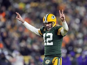 Green Bay Packers quarterback Aaron Rodgers celebrates after a touchdown.