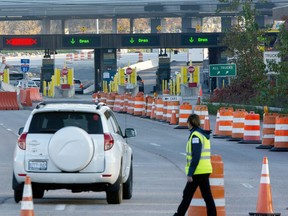 A car crosses the Canada-U.S border at the Thousand Islands crossing after the border officially reopened for fully-vaccinated Canadian travellers on Monday Nov. 8, 2021.