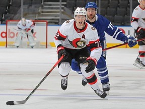 Thomas Chabot (72) of the Ottawa Senators chases back up ice for a puck against the Toronto Maple Leafs during an NHL game at Scotiabank Arena in Toronto on Jan. 1, 2022.