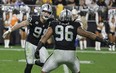 Defensive end Maxx Crosby (left) and defensive tackle Darius Philon of the Las Vegas Raiders.