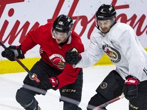 Ottawa Senators forward Drake Batherson (left) and defenceman Josh Brown during the team's practice at the Canadian Tire Centre.