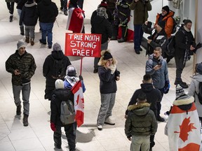 Unmasked protestors were inside the Rideau Centre shopping centre on Saturday. The mall was closed in late afternoon.