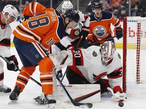 Oilers forward Zach Hyman (left) looks for a rebound in front of Senators goaltender Matt Murray on Saturday.  Murray stopped 60-of-65 shots in two wins against the Flames and Oilers.