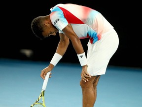 Canada's Felix Auger-Aliassime reacts after loosing a point against Russia's Daniil Medvedev during their men's singles quarter-final match on day ten of the Australian Open tennis tournament in Melbourne on January 26, 2022.