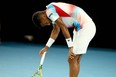 Canada's Felix Auger-Aliassime reacts after loosing a point against Russia's Daniil Medvedev during their men's singles quarter-final match on day ten of the Australian Open tennis tournament in Melbourne on January 26, 2022.