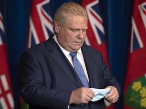 Ontario Premier Doug Ford attends a news conference in Toronto on Monday, January 3, 2022.