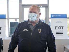 Ontario Premier Doug Ford arrives at a vaccine clinic for Purolator employees and their families at the company's plant in Toronto, Friday, Jan. 7, 2022.