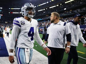 Cowboys quarterback Dak Prescott walks off the field after losing to the 49ers in the NFC Wild Card Playoff game at AT&T Stadium in Arlington, Texas, Sunday, Jan. 16, 2022.