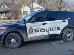 Two Hamilton cops were seriously injured and a police vehicle damaged when a motorist took off from a New Year's Eve RIDE check on Friday, Dec. 31, 2021.