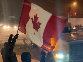 Protestors/supporters were on hand waving flags in support of truckers in convoys headed to Ottawa, Thursday, Jan. 27, 2022.
