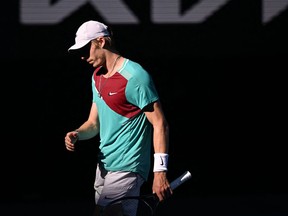 Canada's Denis Shapovalov looks on between points with Spain's Rafael Nadal during their men's singles quarter-final match on day nine of the Australian Open tennis tournament in Melbourne on January 25, 2022.