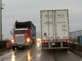 Cross-border transport trucks cross paths on the Peace Bridge at the Canada-U.S. border in Buffalo, N.Y., Jan. 10, 2018.