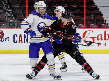 Ottawa Senators left wing Brady Tkachuk (7) checks Buffalo Sabres defenceman Robert Hagg (8) during the third period.