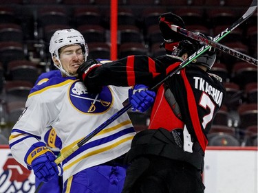 Ottawa Senators left wing Brady Tkachuk (7) checks Buffalo Sabres defenceman Robert Hagg (8) during the third period.