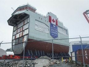 Files: The centre block of the future HMCS Max Bernays is moved from the fabrication building to dockside at the Irving Shipbuilding facility in Halifax on Friday, Jan. 22, 2021.