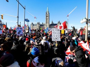 Protestors gather in front of Parliament Hill as truckers and supporters take part in a convoy to protest coronavirus disease (COVID-19) vaccine mandates for cross-border truck drivers in Ottawa, Ontario, Canada, January 29, 2022. REUTERS / Patrick Doyle