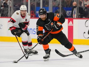 Senators forward Nick Paul, left, seen here in the team's previous game against the Philadelphia Flyers on Dec. 18, was among the Ottawa players placed on the NHL's COVID-19 protocol list on Saturday.