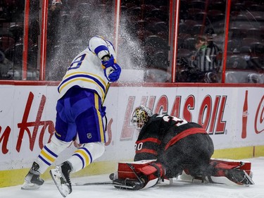 Ottawa Senators goaltender Matt Murray (30) covers the puck behind his net against Buffalo Sabres left wing Zemgus Girgensons (28) during the second period.