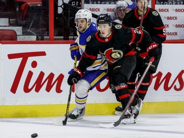 Ottawa Senators defenceman Jacob Bernard-Docker (24) checks Buffalo Sabres left wing Anders Bjork (96) during the second period.